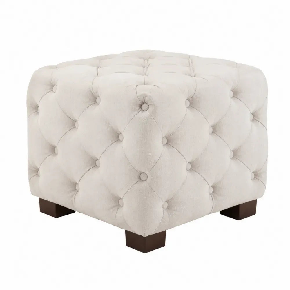 Reposapiés puff cúbico tapizado en tejido beige capitoné con patas de madera maciza 45 x 45 x 40 cm